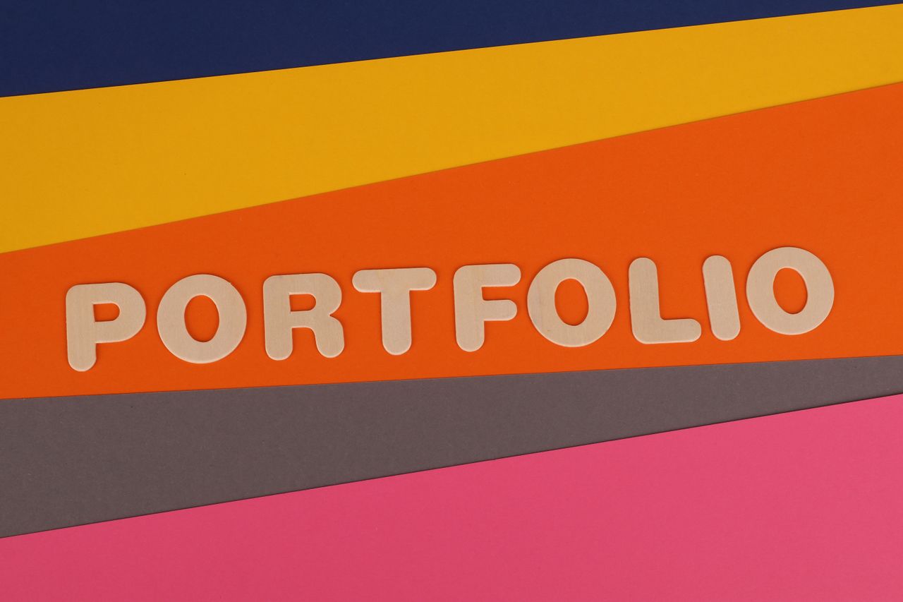 about-img-01 A vibrant multicolored background featuring the text 'PORTFOLIO' in pink font on colorful paper.